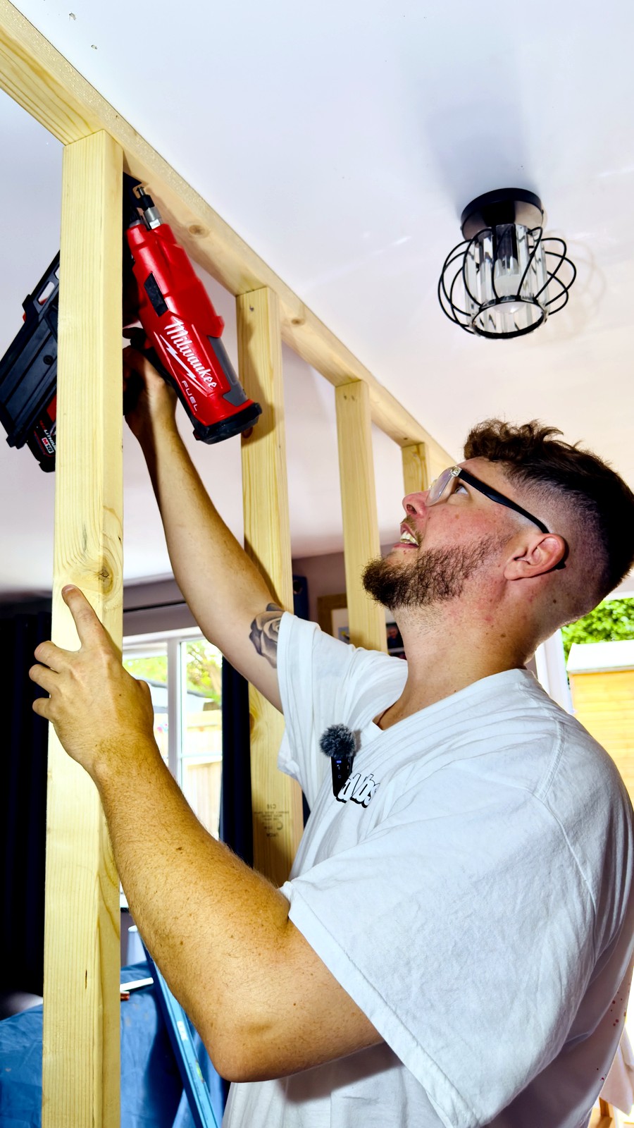 Man using nail gun ceiling - other works project by OddJobs in Kent